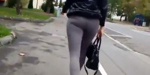 Blonde woman wearing dark grey leggings