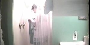 Sexy sporty girl gets caught in a shower by a hidden cam