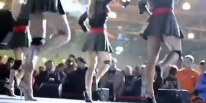 Short pleated skirts and heels on sexy dancing girls