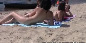 Shy girl pops her top off for all the beach goers