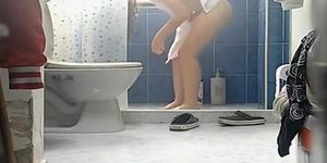 Chick with thick thighs and small boobs spied in bathroom