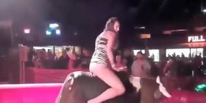 Fabulous girl has her crotch revealed while riding the bull