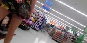 Slim daring girl spreads firm butt cheeks in the supermarket