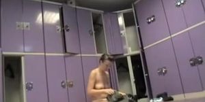 Naked female is sitting on the changing room bench