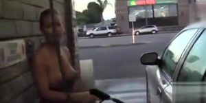 Hot blonde looker with big boobs washes a car in the nude