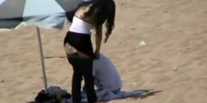 Couple making out on the beach