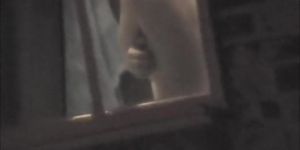 Raunchy window voyeur pics of the hot round titties