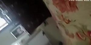 Wife taking off pants in bedroom