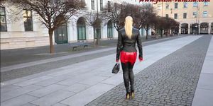 blonde in leather and  tugh high boots