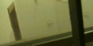 Perky breasted blonde caught in the shower by a window voyeur