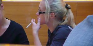 confident blond smoking in a meeting
