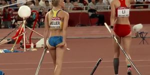 Sexy sportswoman with a big butt does pole vaulting