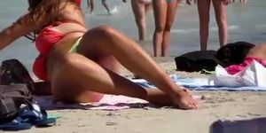 Sexy thick brunette in thong at beach