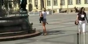 Blonde milf in an outdoor upskirt tease video