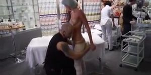 Topless sunburned girl wrapped to relieve her pain