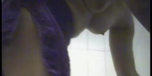 Female towels nude body on dressing room spy camera