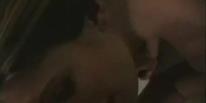 Brunette maintains eye contact while sucking his dick