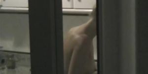 Window shot of a naked woman in the kitchen (Dirty Little, Dirty little)