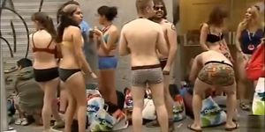 Spain students wearing only underwear wait in front of the shop for it to open