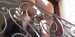 Blonde businesswoman fucks on balcony