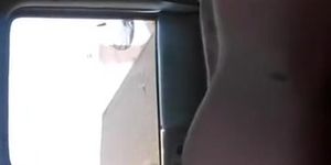 Guy strokes cock in traffic