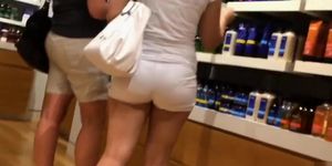 Shopping with a big butt woman in tight shorts