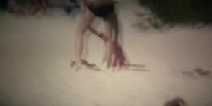 Intriguing, hot redhead in a nude beach video