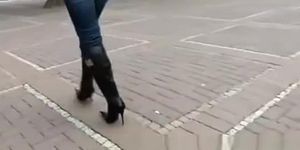 High heel black boots and tight jeans