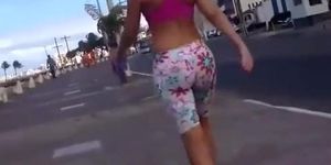 Brunette in spandex shorts walking