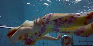 Blonde in a dress in a pool