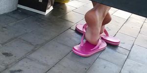 Candid girl feet in flip flops