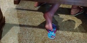 Candid girl shoeplay in flip flops