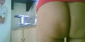 LATINA MATURE NUDE KITCHEN