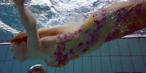 Sexiest brunette Milana Voda swimming in pool