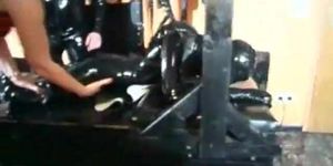 Slut in leather costume and mask gets spanked