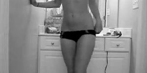 Perfect body blonde teen strips in the bathroom