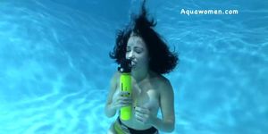 Underwater girl with big tits breathes from spare air