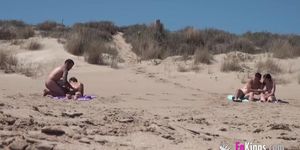sunbathing on a nude beach, guy joins her and other couple gets horny too
