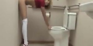 This Girl Takes A Big Dildo In Her Twat In A Toilet