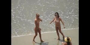 Girls pose for picture nude on beach thinking they are alone
