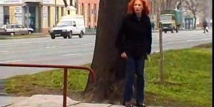 Mature redhead taking a piss in a public park