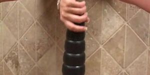 Busty babe riding two big brutal dildos