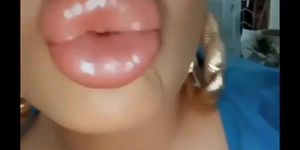 Big fake bimbo lips kissing