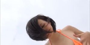 Cute petite pale brunette idol Yori posing on the beach