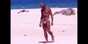 Tanned guy on beach in tiny string thong temporarily (amateur )