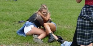 Beautiful girls drunk on the grass