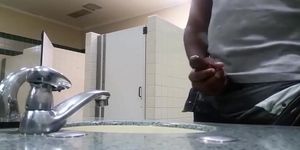Black perv caught jerking in restroom