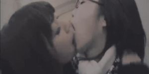 Hot Japanese girls kissing and wiggling their tongues (edited).