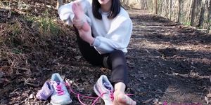 Asian girl licks her own feet