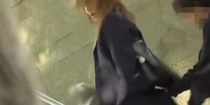 Japanese schoolgirl sharking on the staircase outdoors